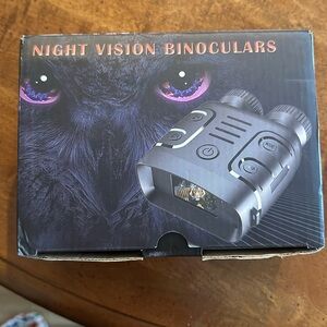 Pair of black night, vision, binoculars, and video recorder